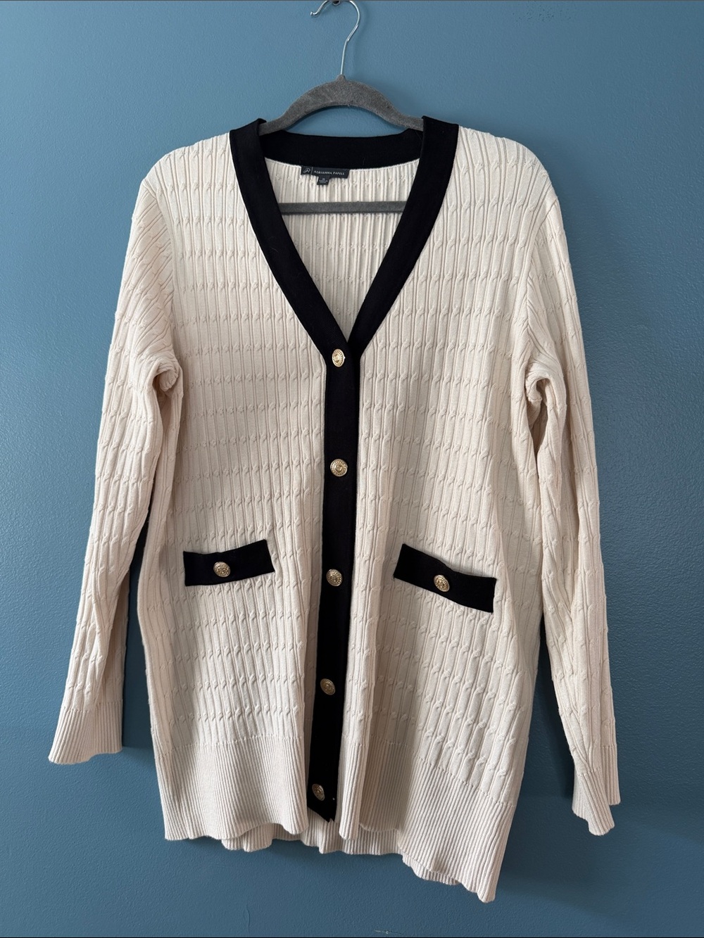 Cream Cable-Knit Cardigan with Black Trim and Gold Buttons. Tunic length